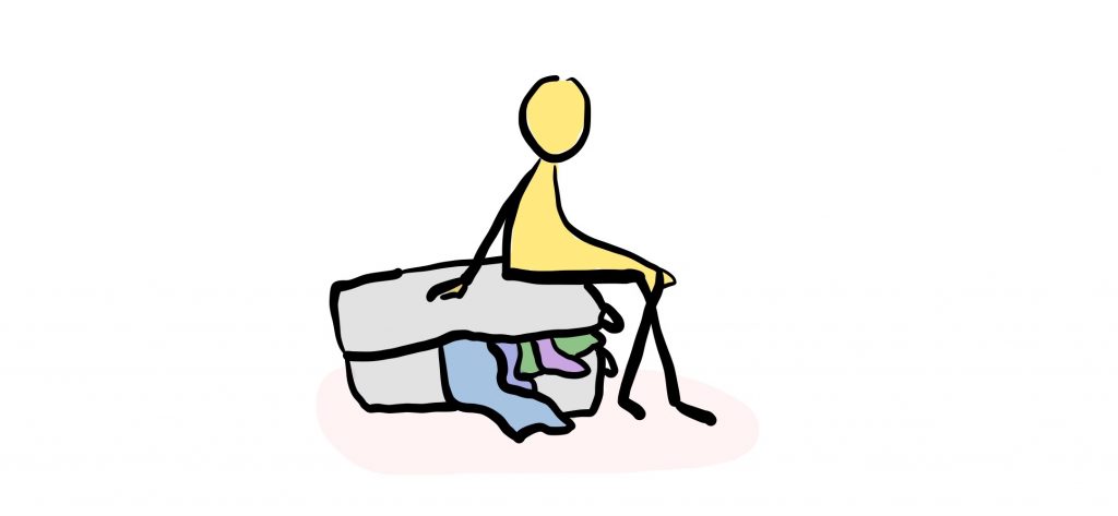 Sitting on a suitcase